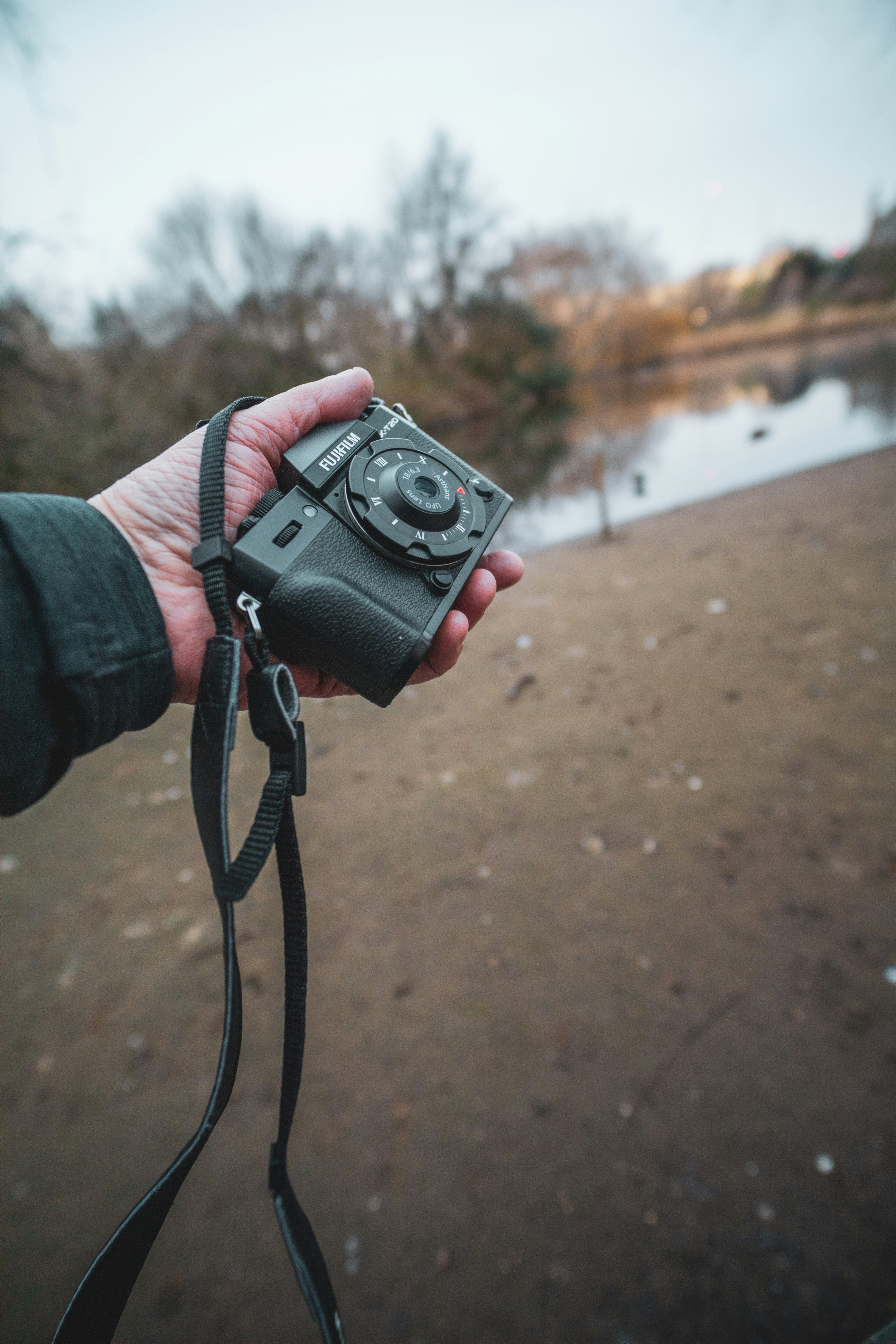 a person holding a camera in their hand