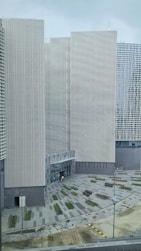 a couple of tall buildings sitting next to each other