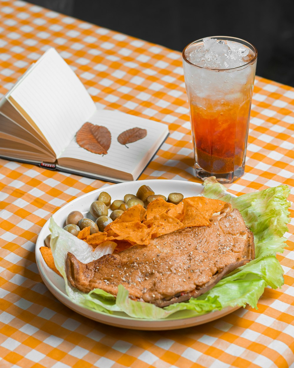 a plate of food and a drink on a table