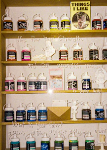 a shelf filled with lots of different types of medicine