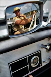 a man driving a car while talking on a cell phone