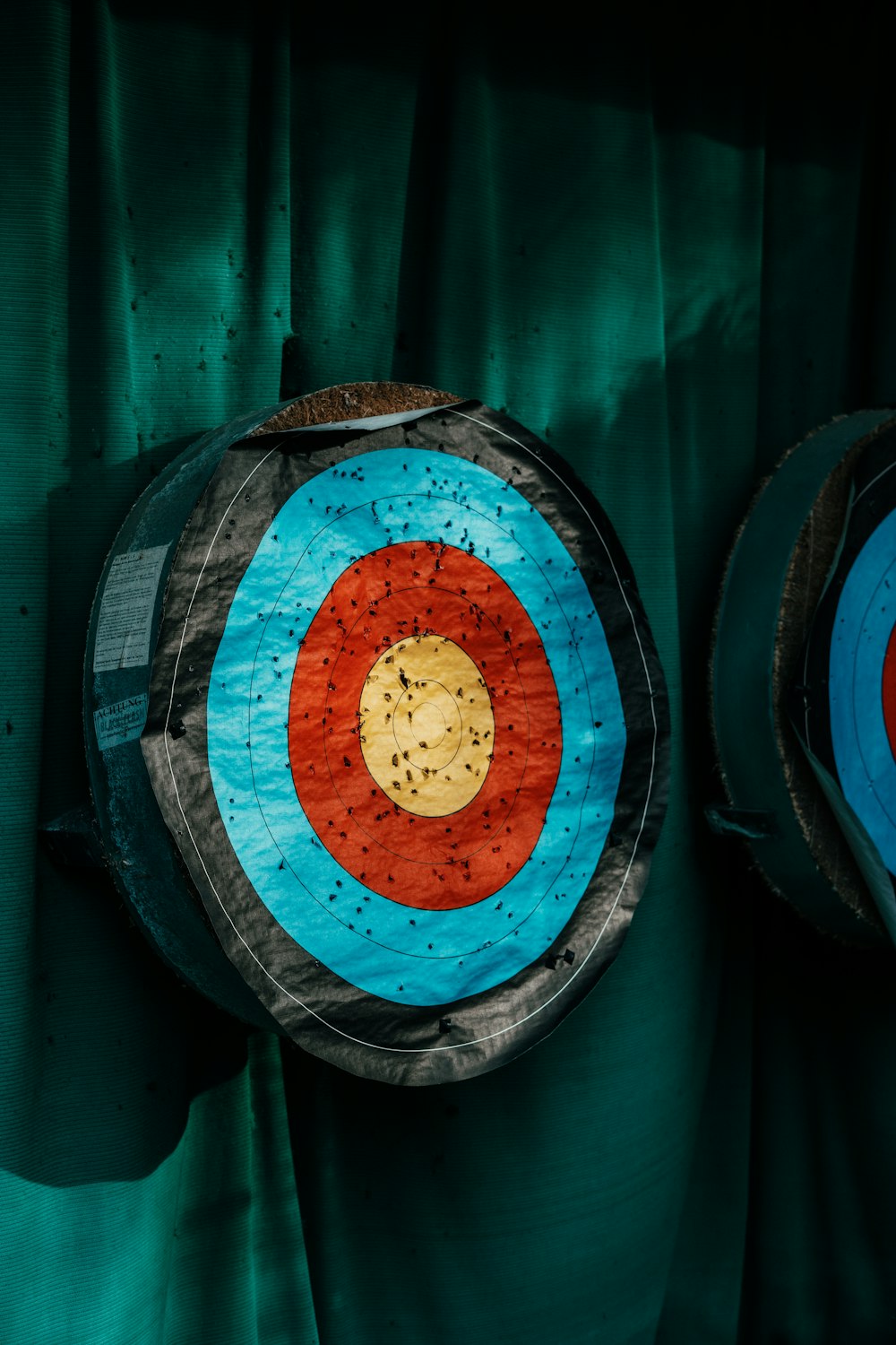 a close up of a target on a green curtain