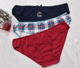 a pair of underwear sitting on top of a wooden floor