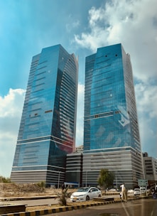 a couple of tall buildings sitting next to each other