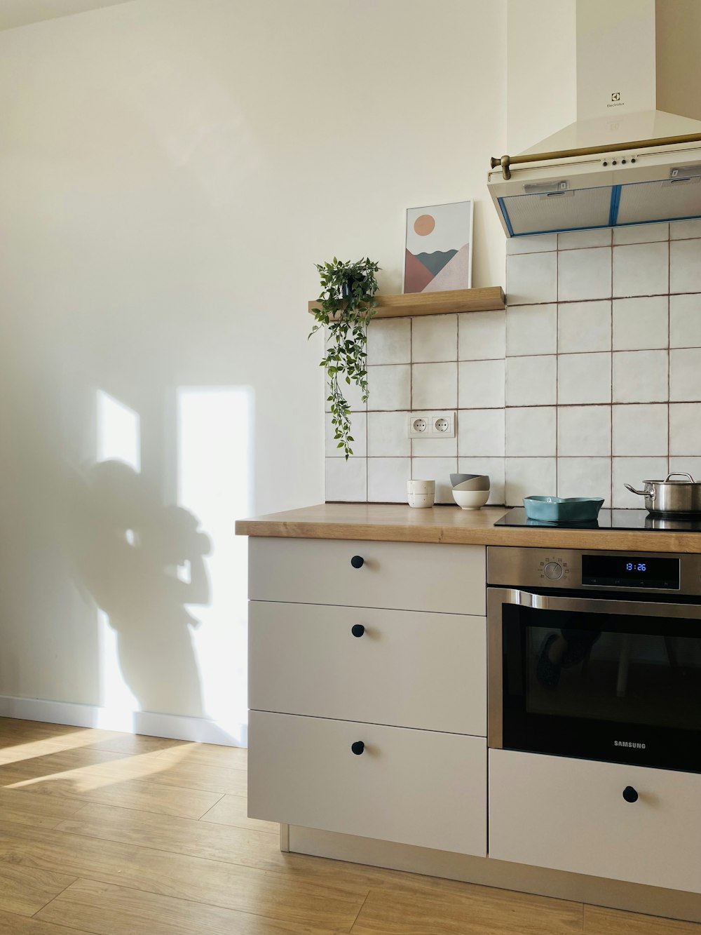 a kitchen with a stove top oven sitting next to a counter