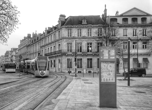 a black and white photo of a train on the tracks