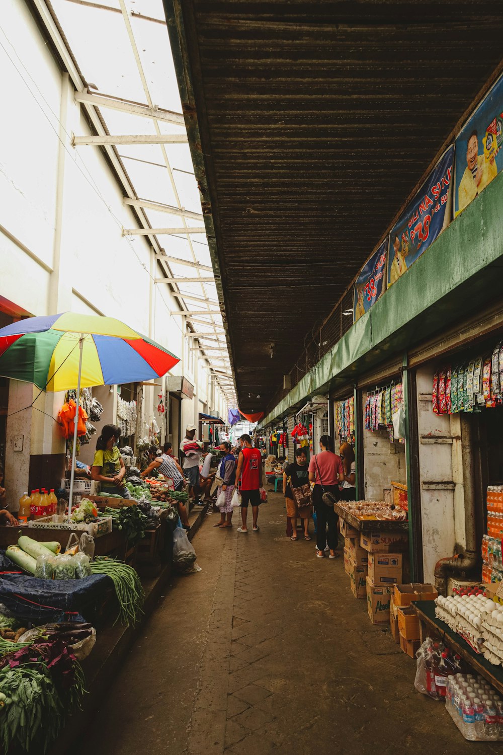 a group of people walking around a market