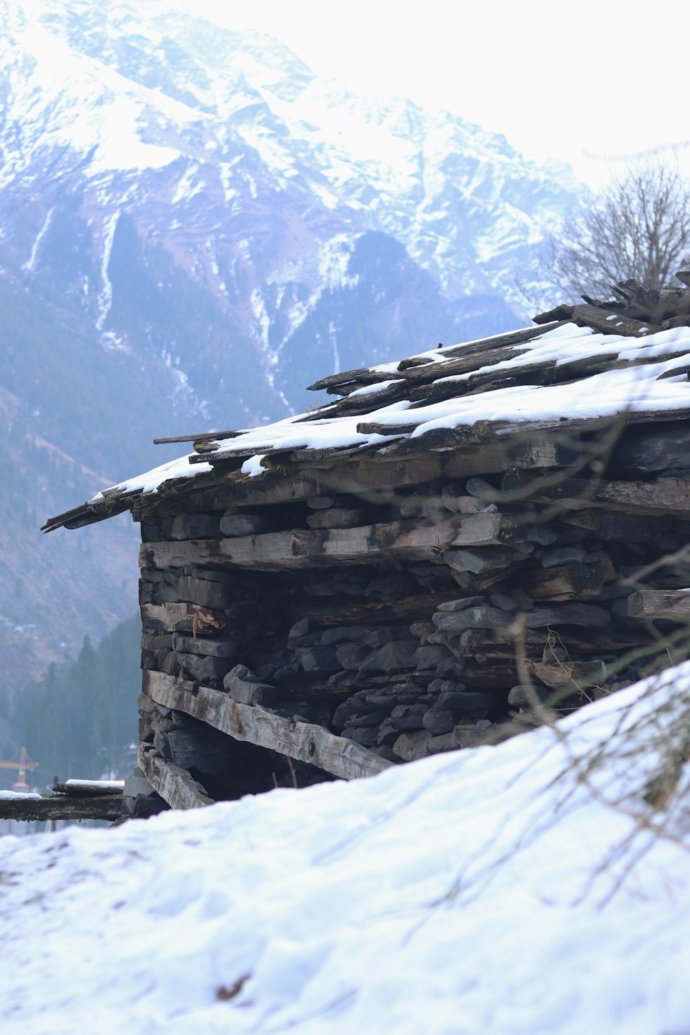 a stone building with snow on top of it