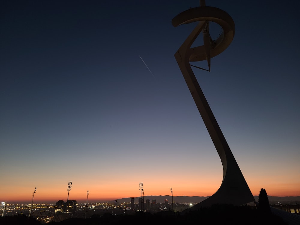 a very tall metal structure with a sky in the background