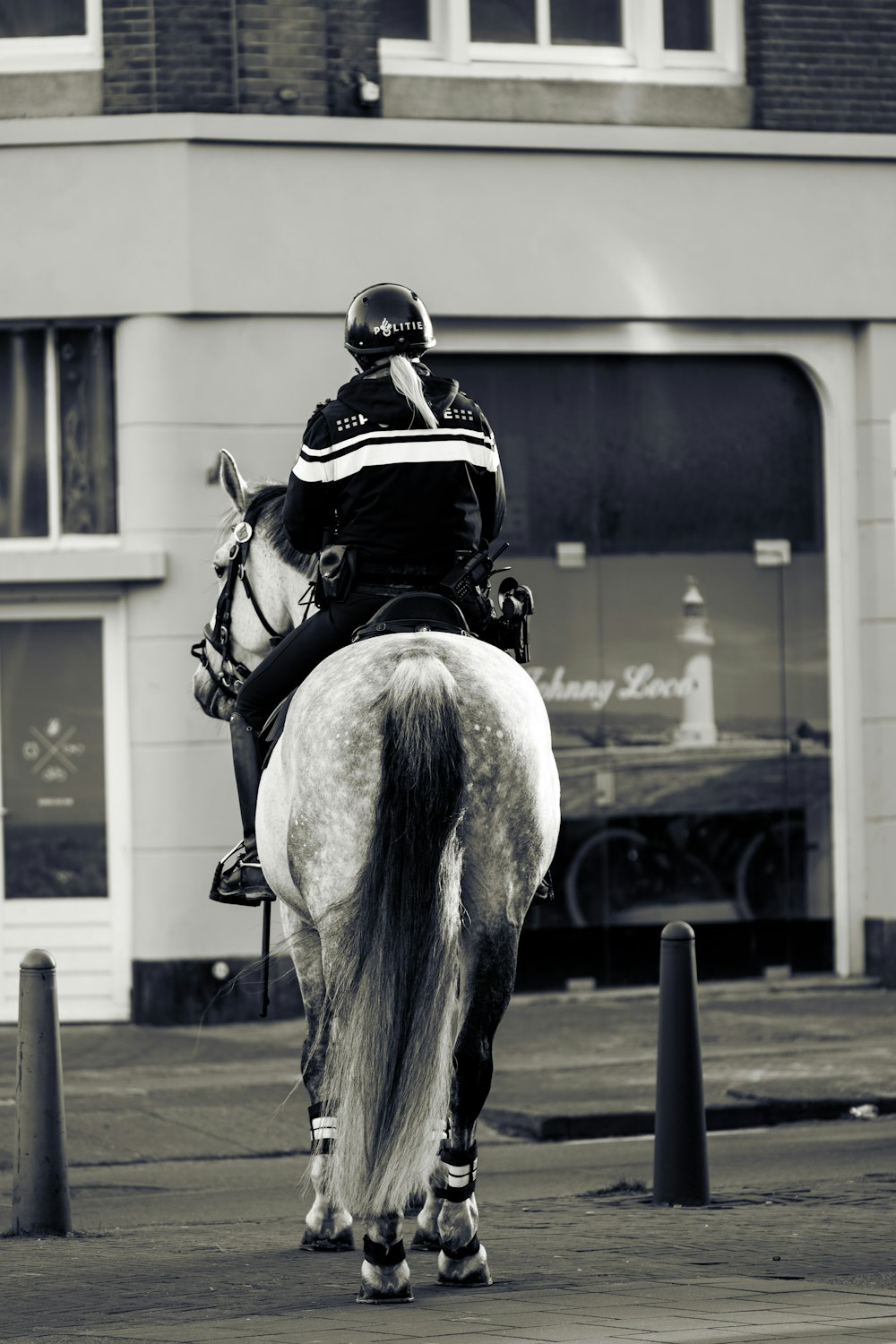 a man riding on the back of a white horse