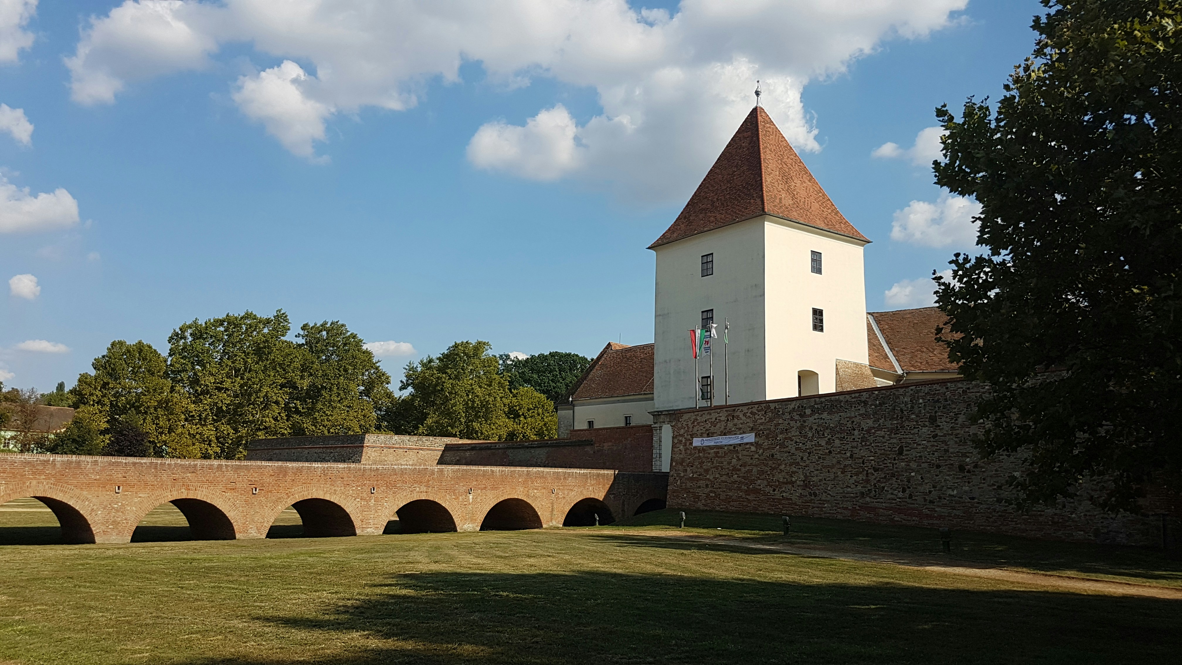 a large white building with a clock tower