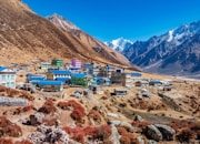 a village in the middle of a mountain range