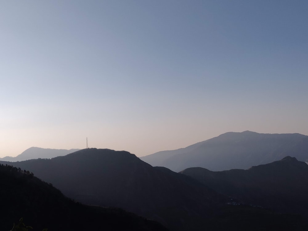 a view of a mountain range at sunset