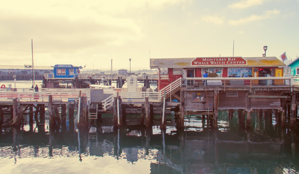 a pier with a restaurant on the top of it