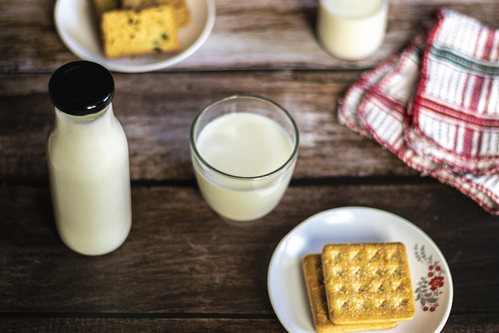a plate of crackers and a glass of milk