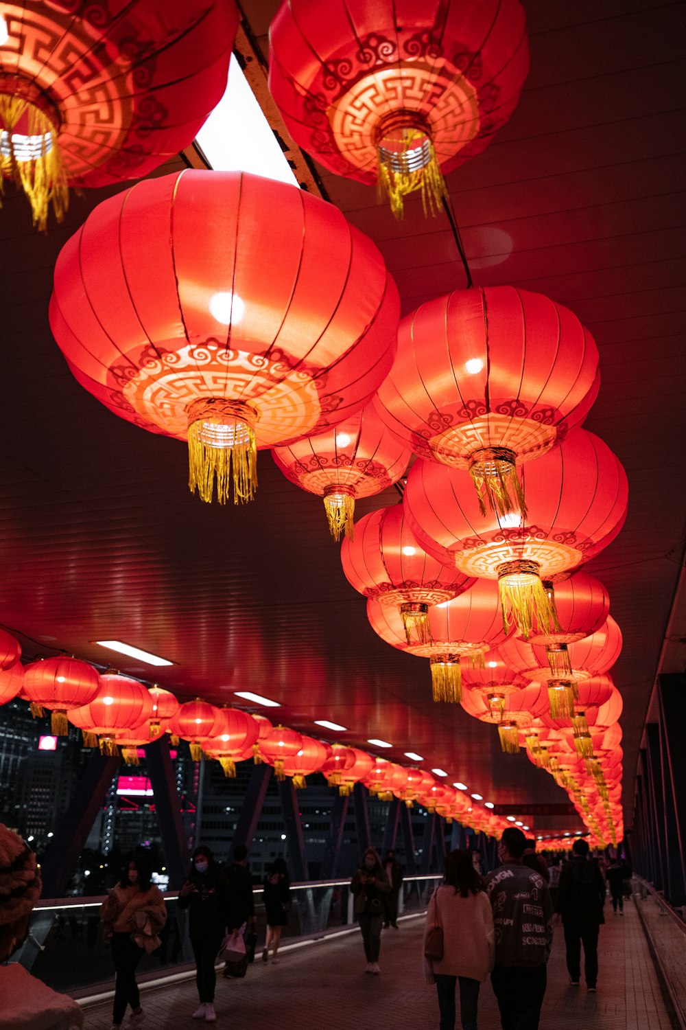 a group of red lanterns hanging from the ceiling