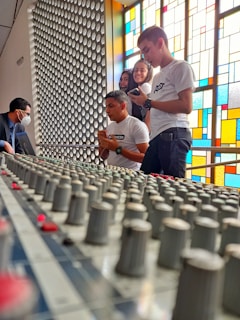 A group of diverse artists collaborating around a mixing console, sharing ideas and smiles