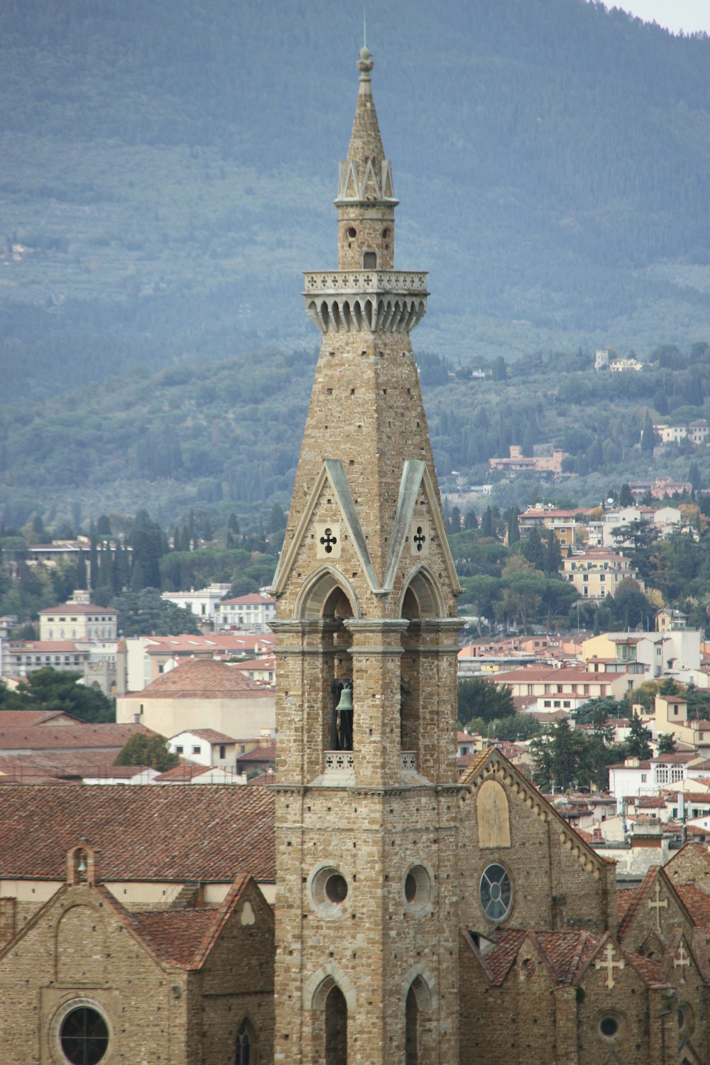 a tall clock tower towering over a city