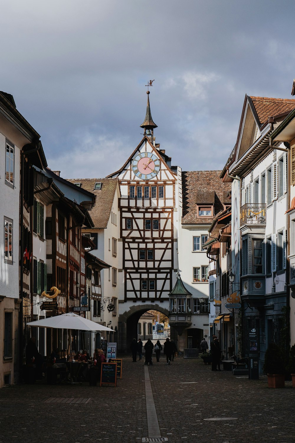 a street with a clock tower in the middle of it