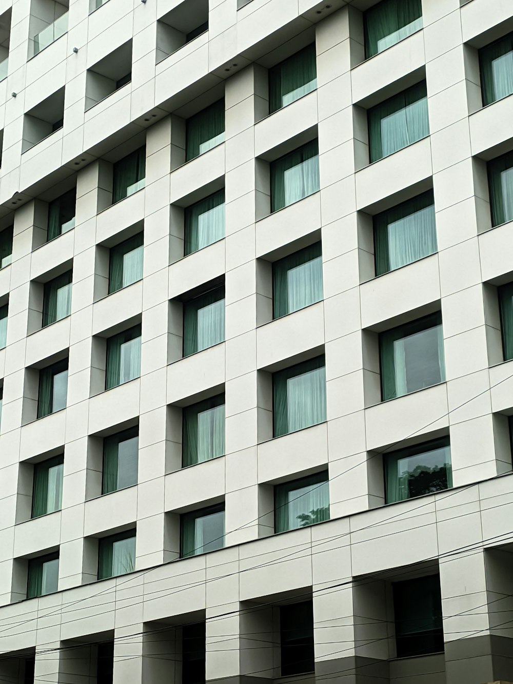 a large white building with lots of windows