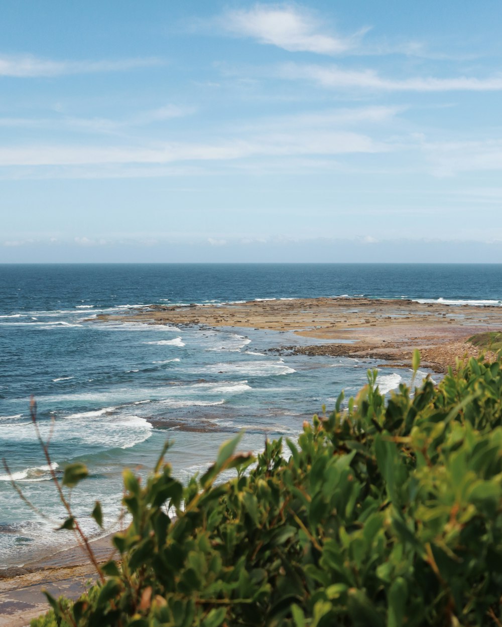 a view of a body of water from a hill