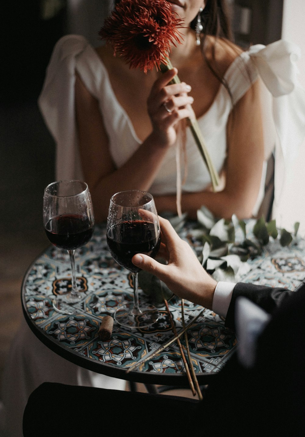 a person holding a glass of wine