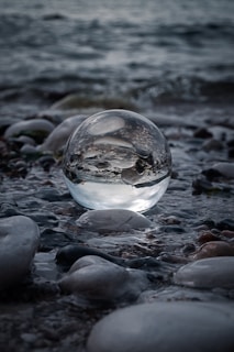 A glowing orb of pale amethyst light hovering gently over calm waters
