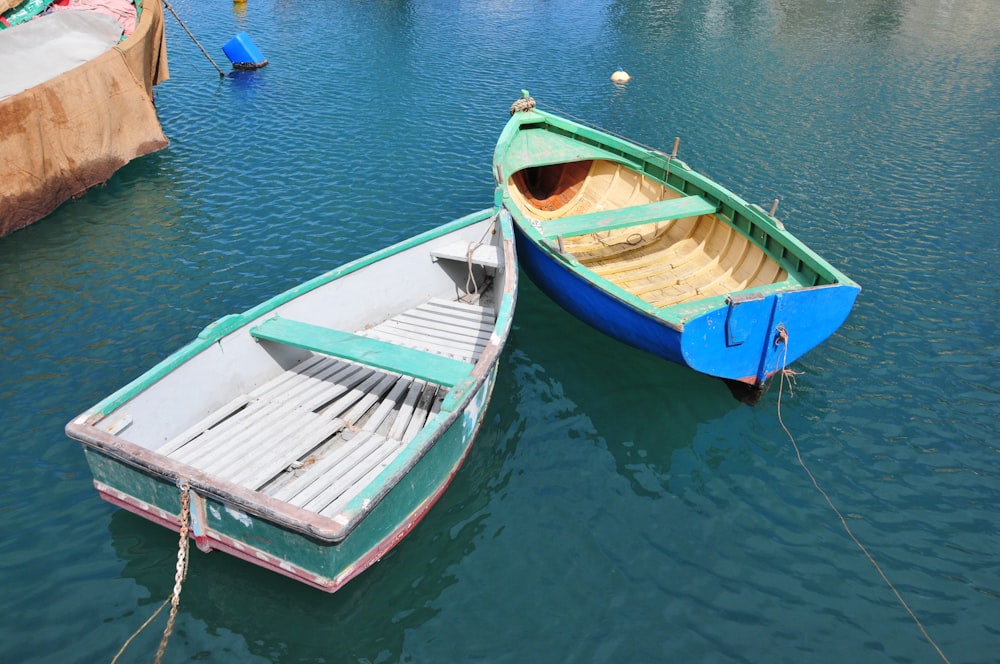 a couple of boats that are sitting in the water