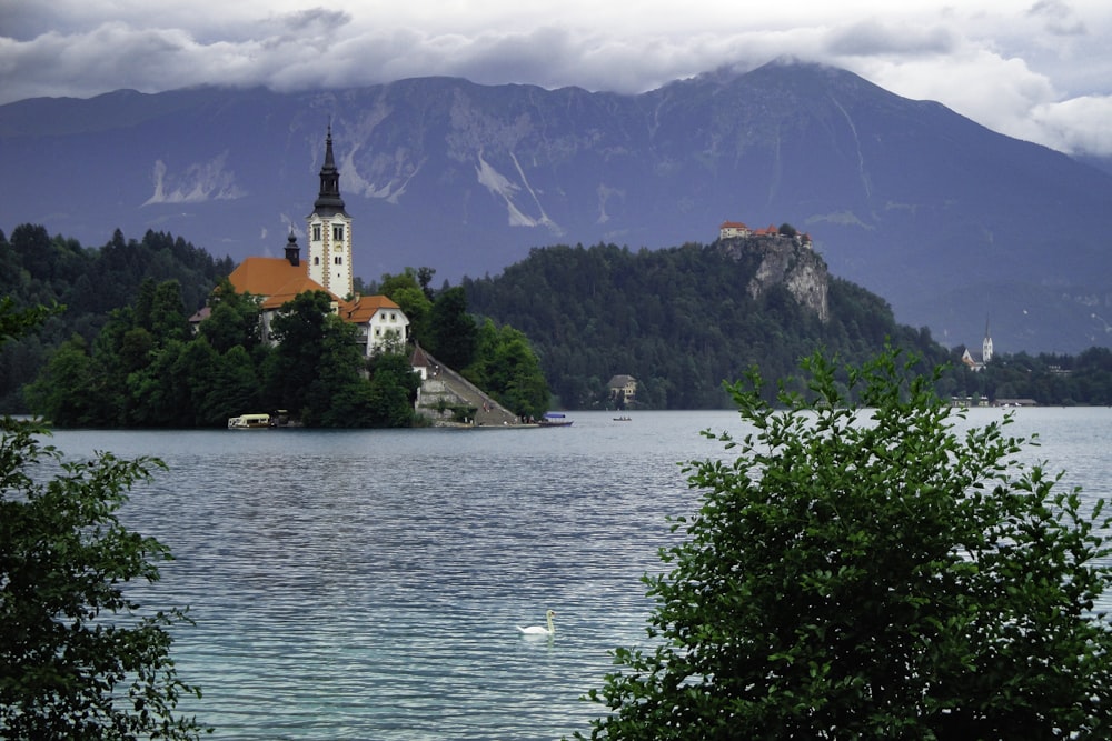 a church on a small island in the middle of a lake