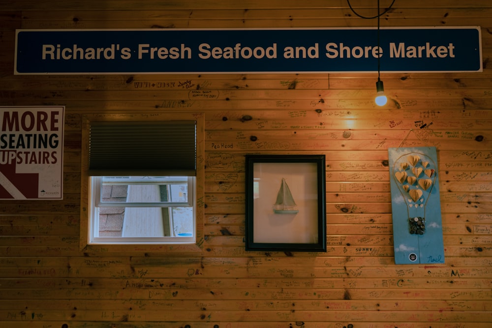 a wooden wall with a sign that says richard's fresh seafood and shore market