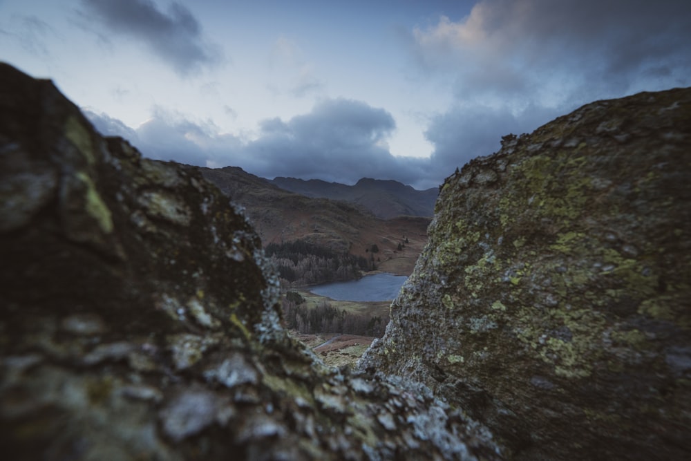 a view of a lake from a rocky outcropping