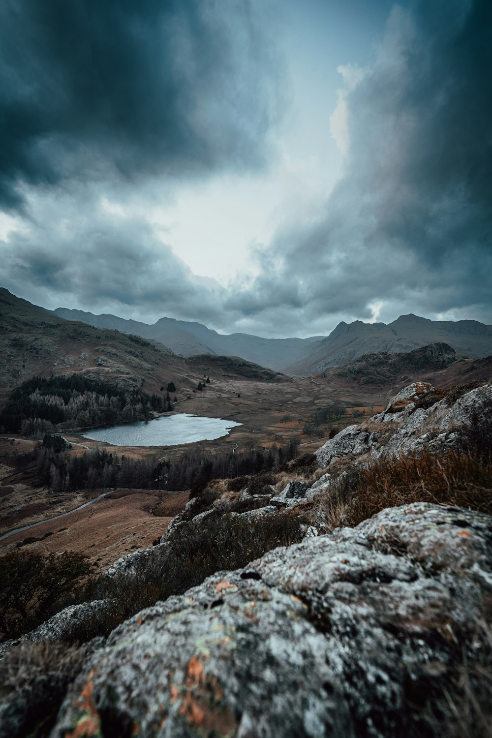 a view of a lake from a rocky outcropping