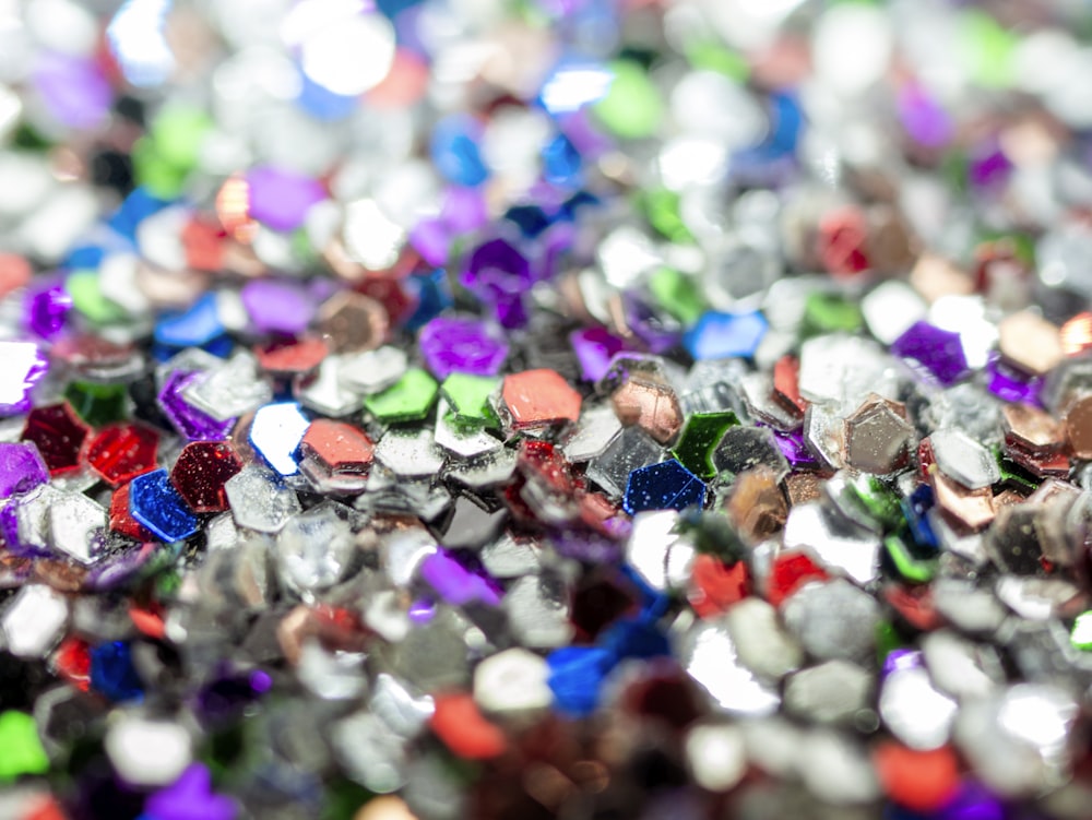 a pile of different colored glass beads