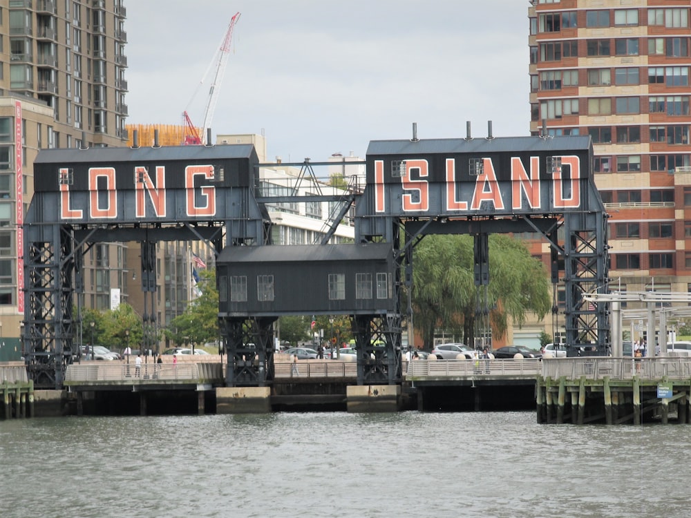 A long island sign on a bridge over a body of water photo – Free Building  Image on Unsplash