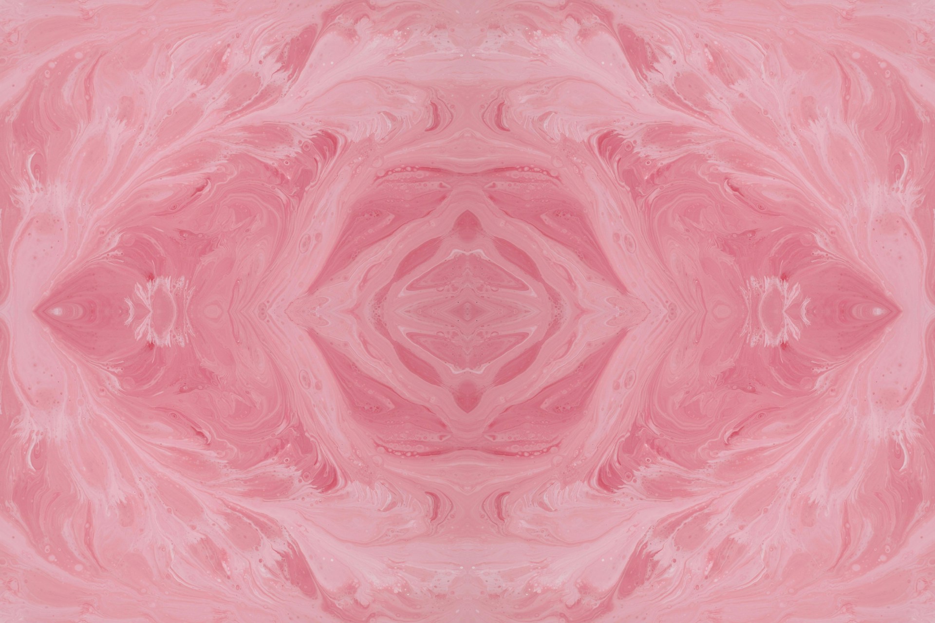 an abstract pink background with a circular design