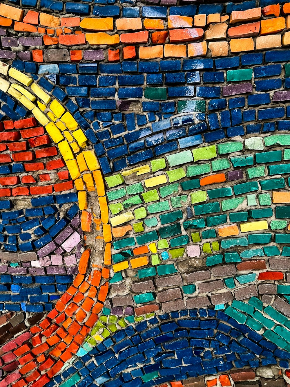 a close up of a colorful brick wall