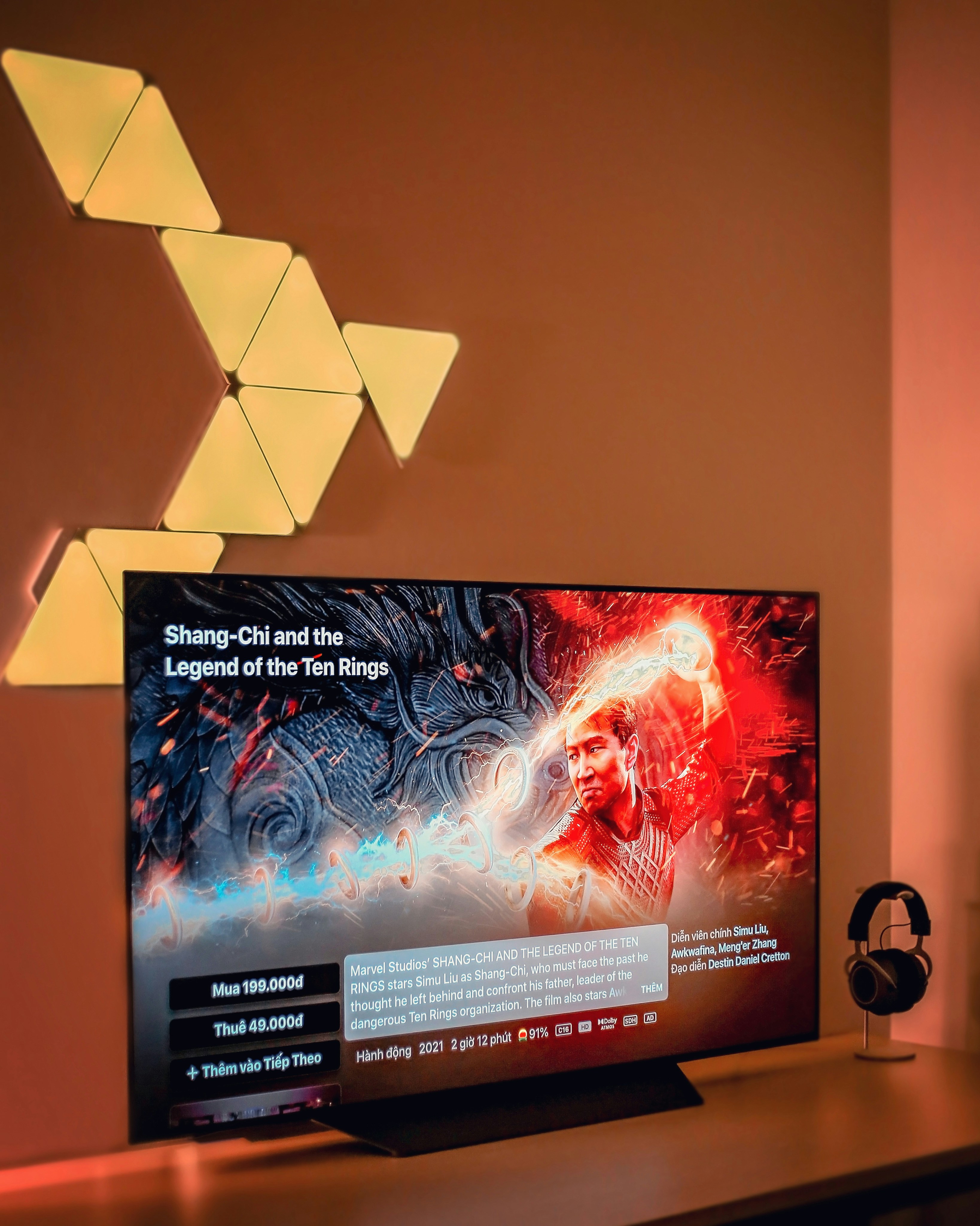 a flat screen tv sitting on top of a wooden table