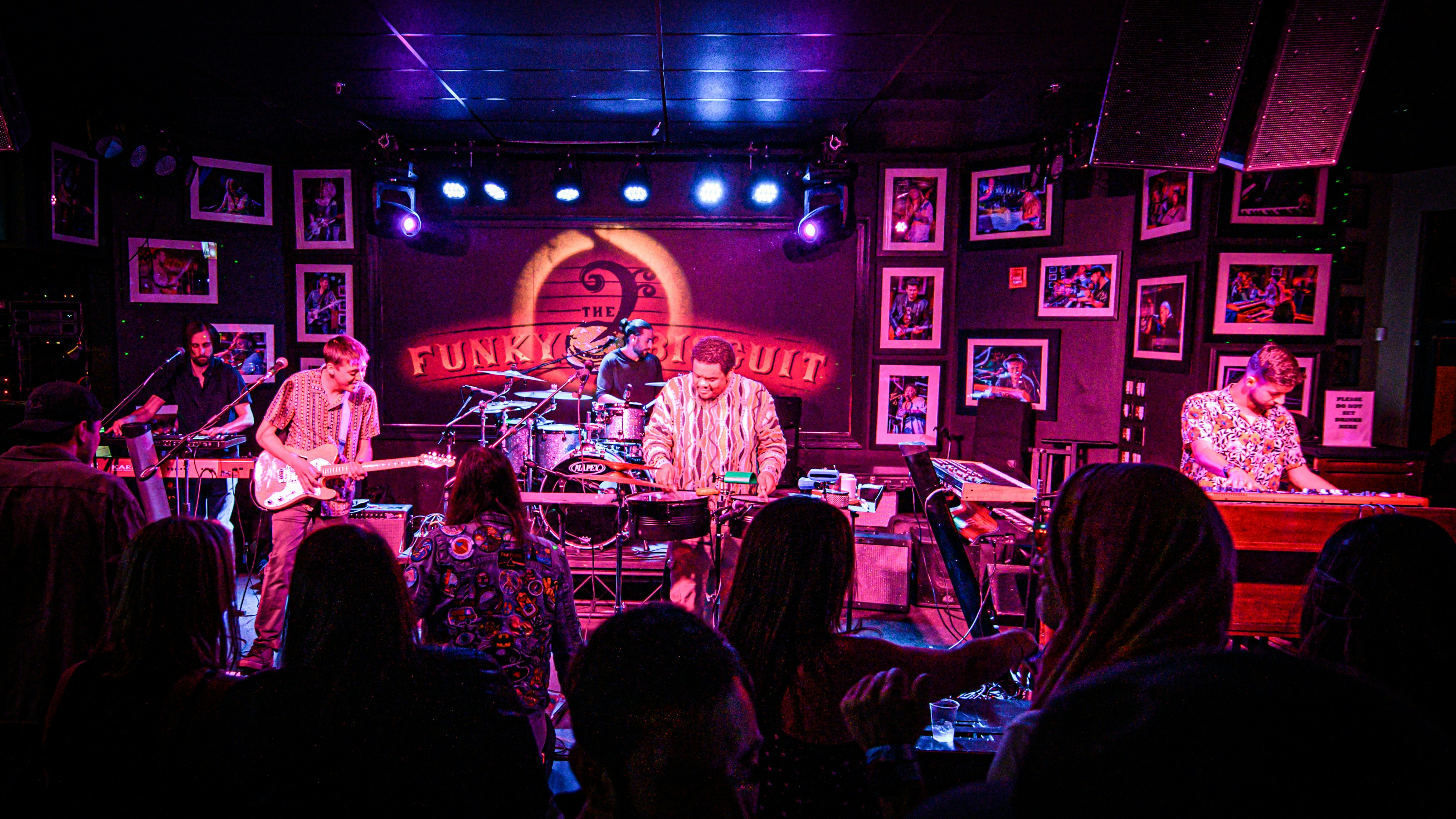 a group of people on stage playing instruments