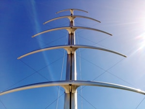 a tall metal structure with a sky background