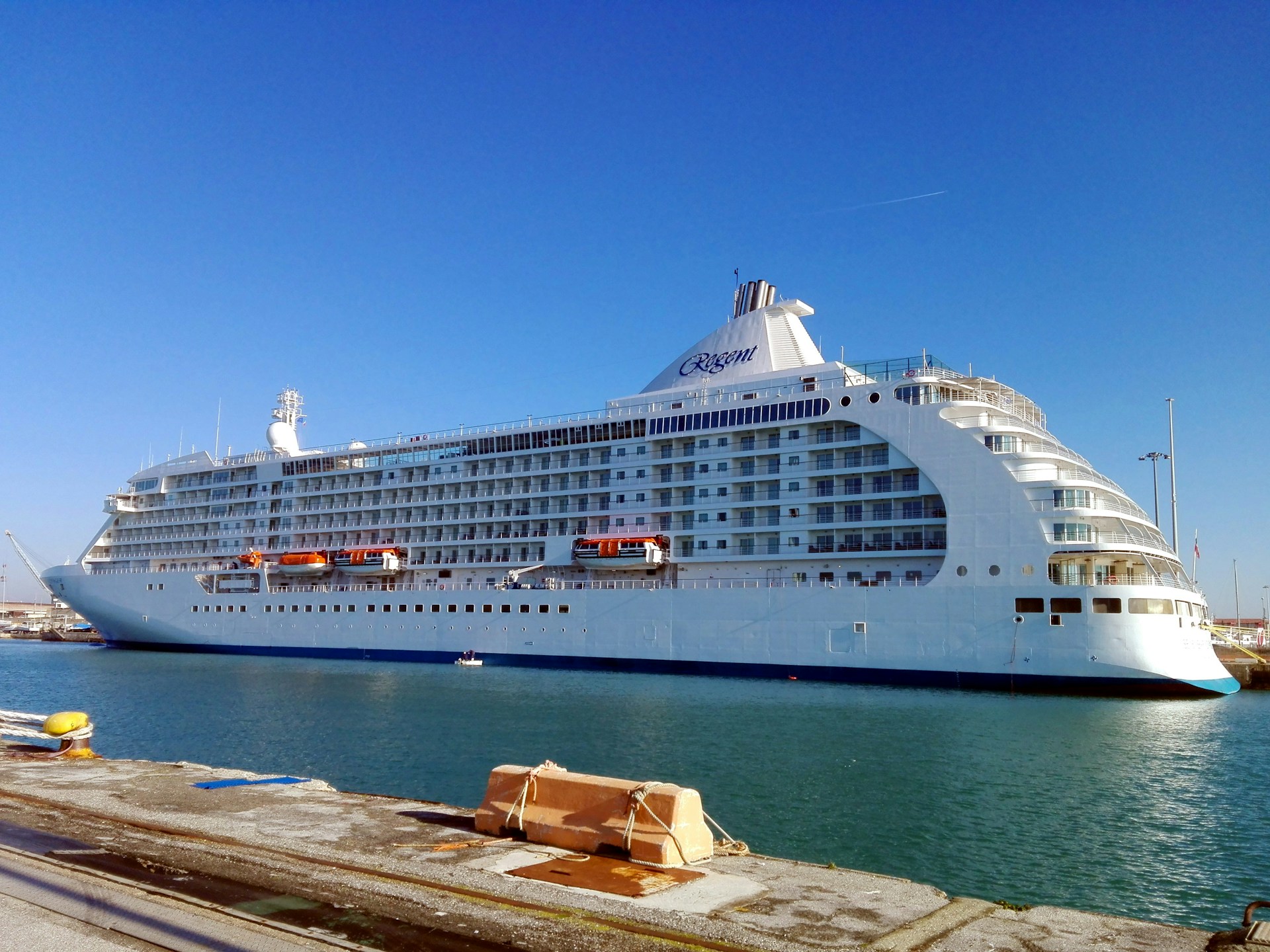 a large cruise ship docked in a harbor