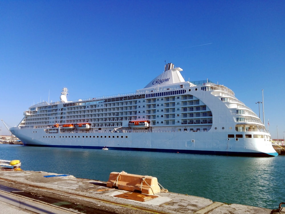 a large cruise ship docked in a harbor