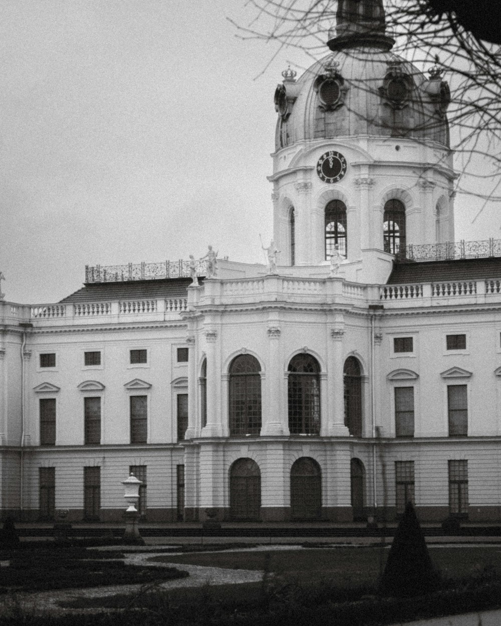 a large white building with a clock tower