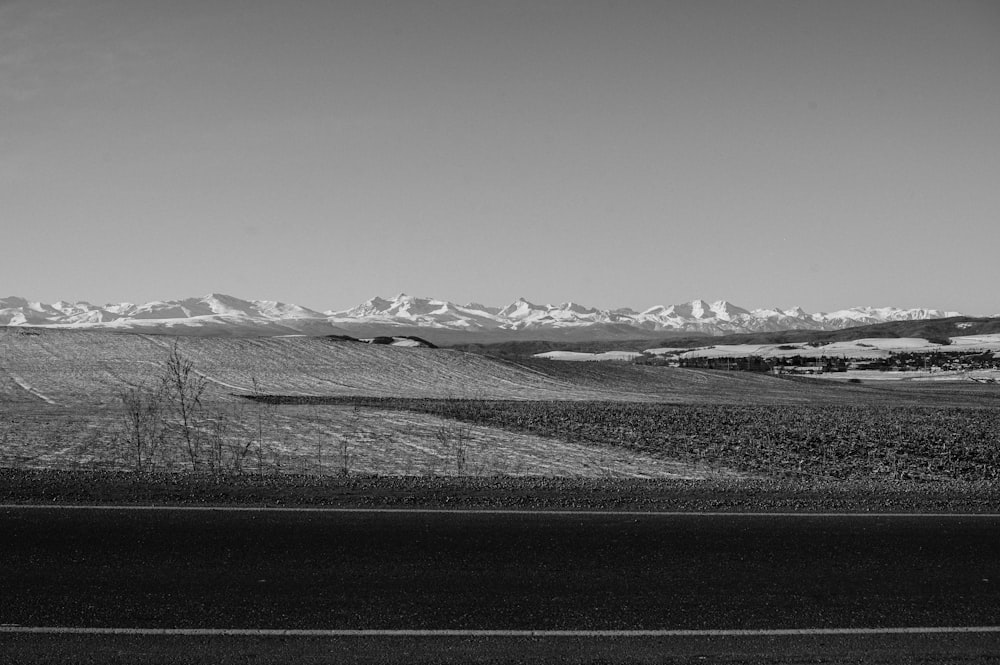 a black and white photo of a mountain range