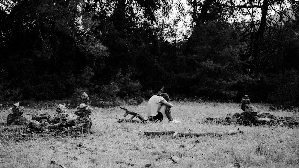 a black and white photo of a group of people in a field