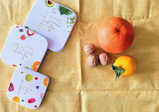 A serene kitchen counter with neatly arranged snack boxes and fresh fruit ready for little hands.