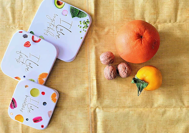 A serene kitchen counter with neatly arranged snack boxes and fresh fruit ready for little hands.