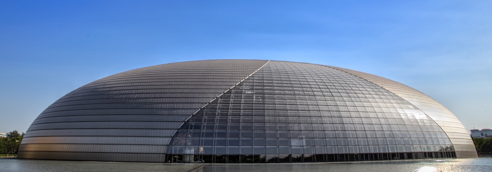 a large domed building sitting next to a body of water