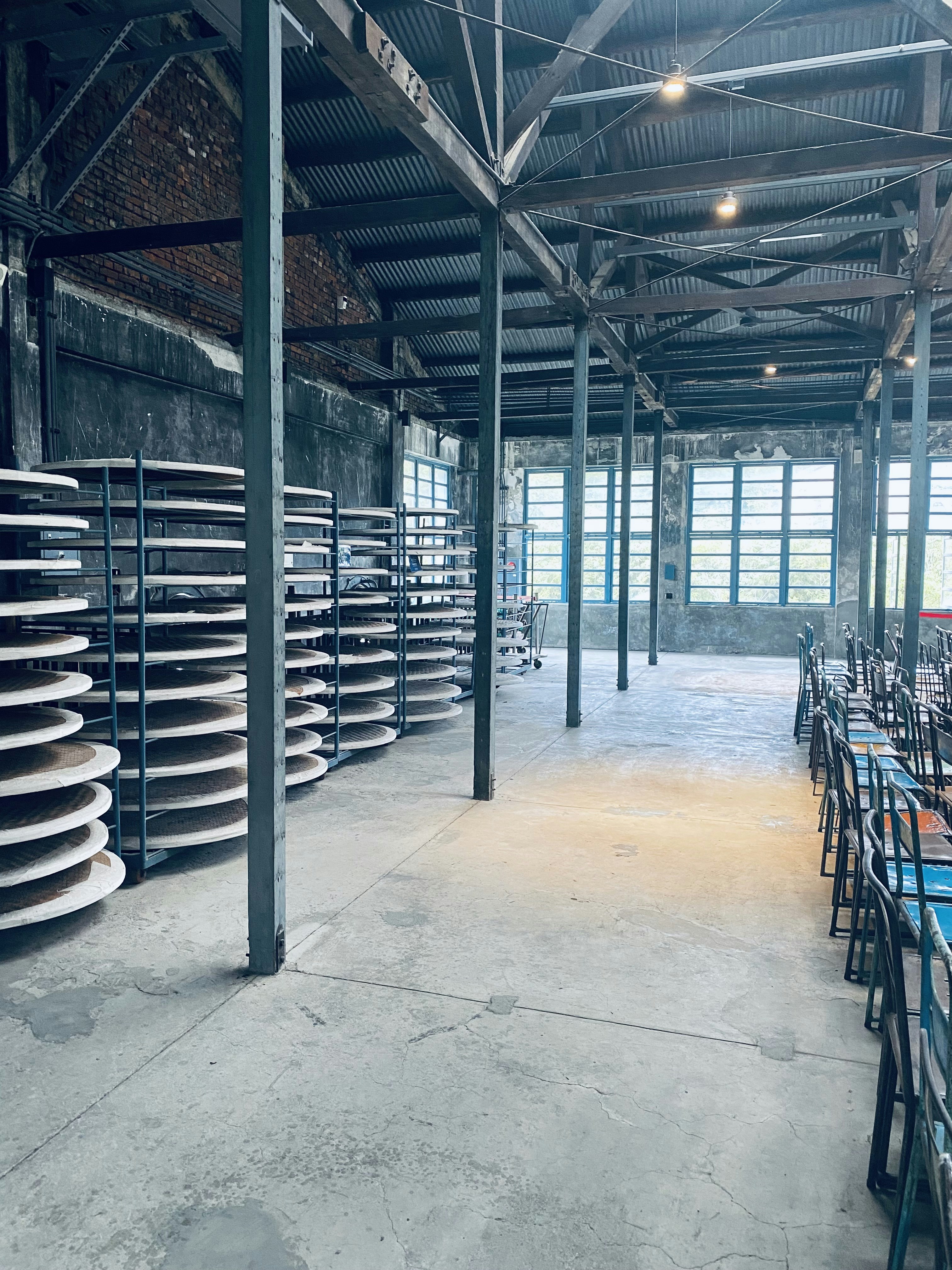 a large room filled with lots of blue chairs