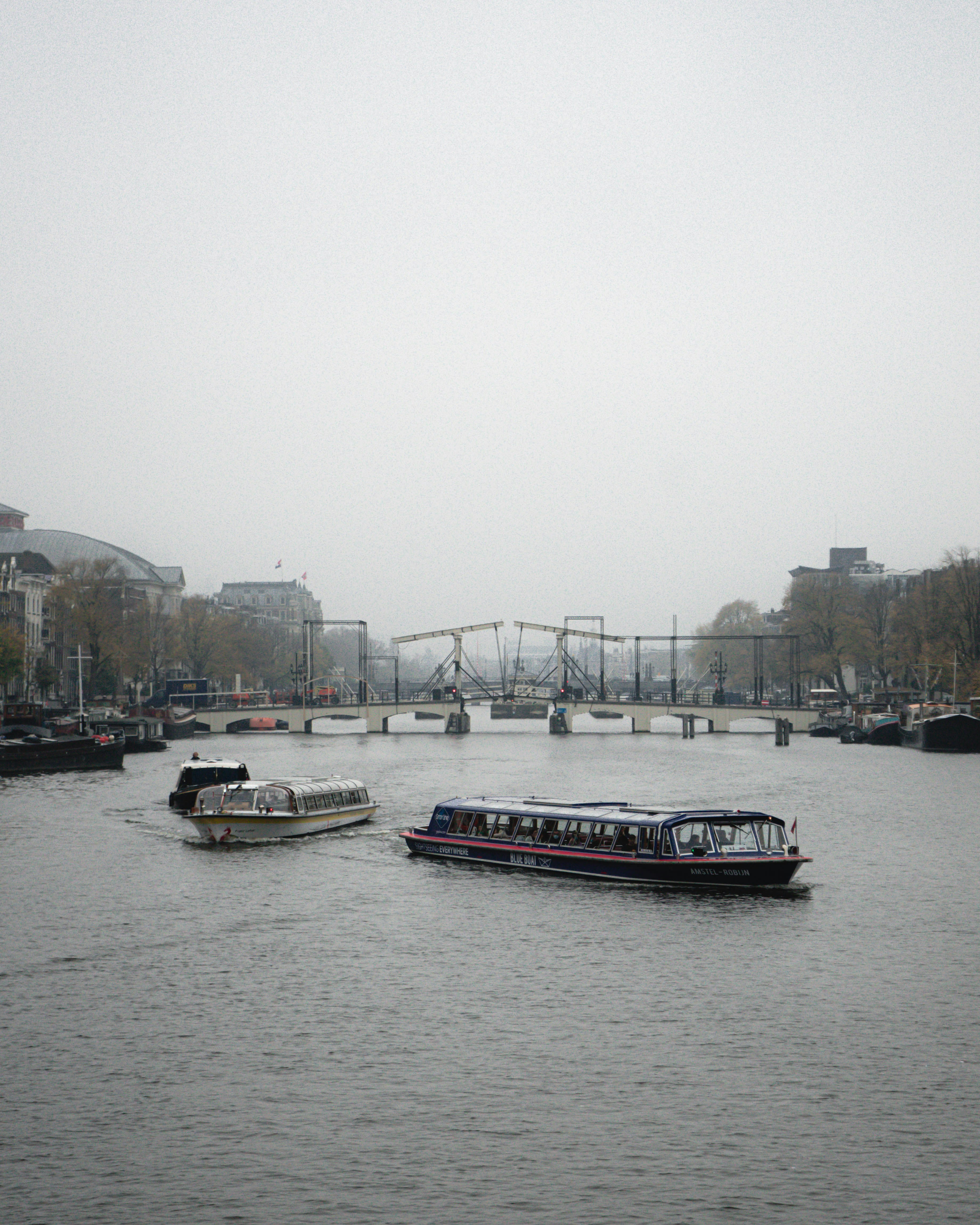 a couple of boats floating on top of a river