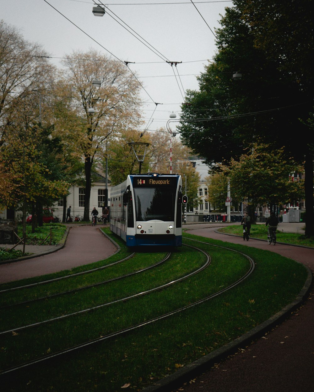 a train on a train track near some trees